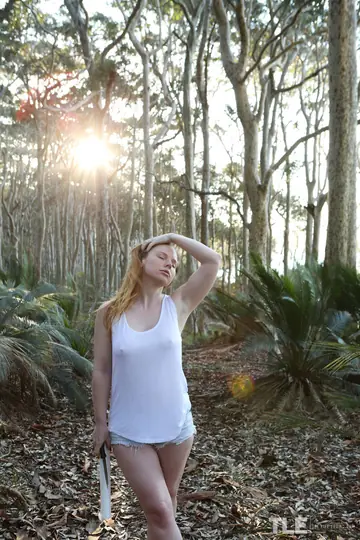 Redhead Bound to a Tree in Plastic Wrap Outdoors