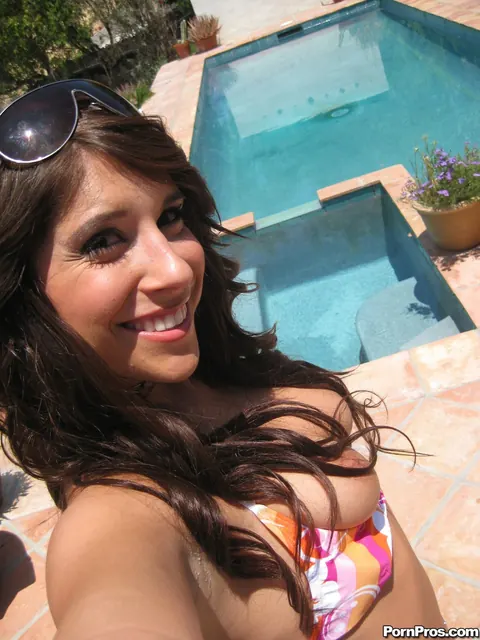 Bella Rey: Busty Brunette in a Bikini and Glasses Poses by the Forest Pool – photo 4 of 17