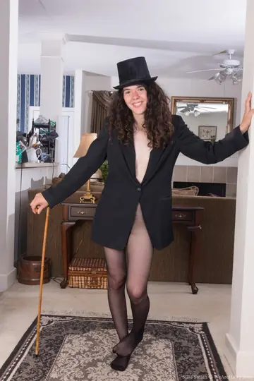 Slim Brunette Strips Off Her Pantyhose to Show Her Hairy Pussy
