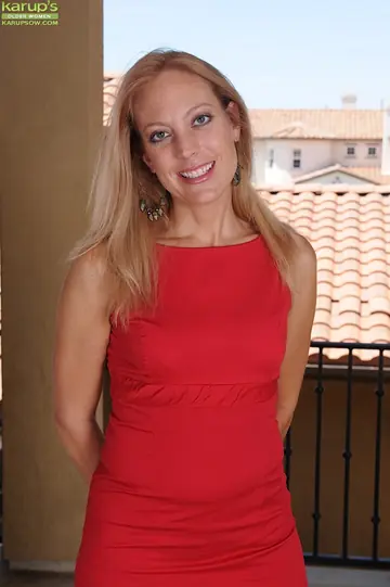 Thick Blonde MILF in a Skirt and Heels Spreads Her Shaved Pussy on the Balcony