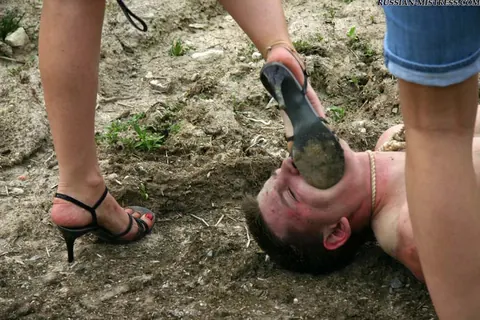 Women in Skirts and Jeans Piss on Submissive Man Outdoors – photo 8 of 16