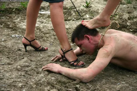 Women in Skirts and Jeans Piss on Submissive Man Outdoors – photo 10 of 16