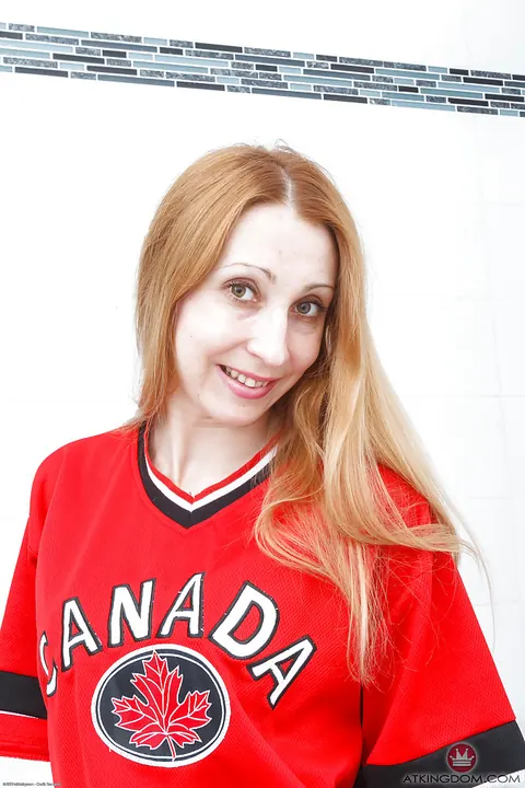 Mature Redhead Pulls Panties Aside in the Bathroom – photo 2 of 16
