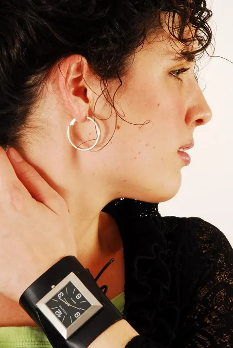 Brunette Woman Poses with Hair Up Wearing a Watch – photo 3 of 16