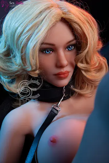Curvy Blonde Poses Nude in Cuffs and Leash