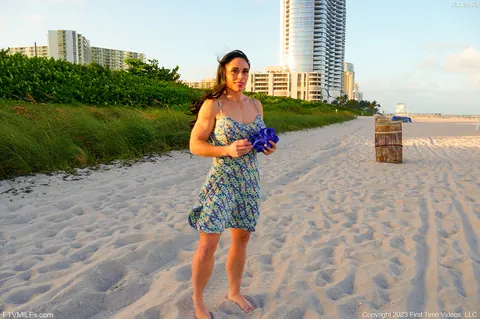 Muscular Brunette MILF Strips Out of Her Bikini on the Beach – photo 2 of 15