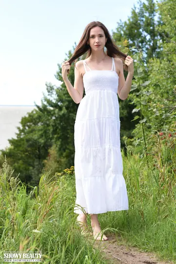 Skinny Woman Strips Out of Her Skirt and Spreads Her Legs Outdoors