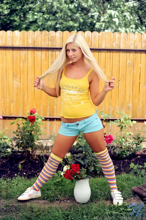 Candy Blond: Blonde in Striped Socks Fingers Her Shaved Pussy in the Yard – photo 4 of 14