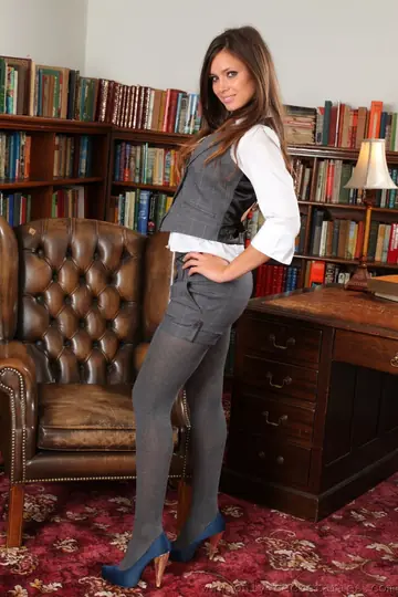 British Brunette Strips Out of Her Uniform in the Library Office