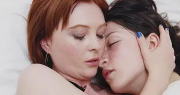 Two European Women Kiss and Embrace