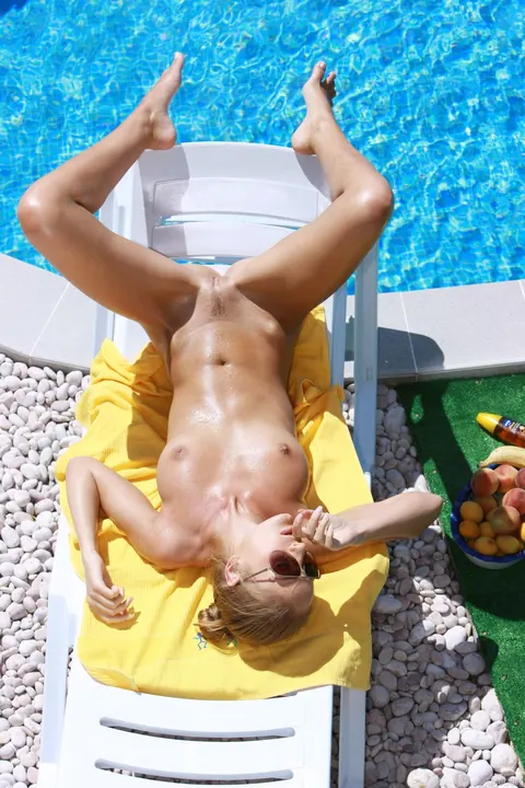 Woman in Glasses and Panties Spreads by the Pool – photo 17 of 21