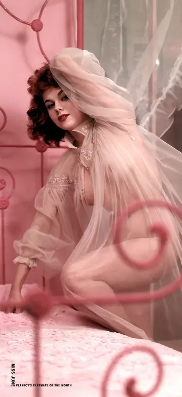 Short Curly Redhead Poses Nude