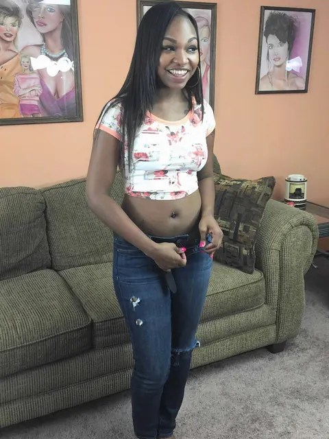 Nikki Ford: Petite Ebony MILF in Jeans Fingers Her Pussy on the Sofa – photo 3 of 20