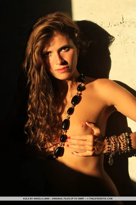 Hairy Woman Undresses by a Brick Wall and Spreads Her Pussy – photo 15 of 16