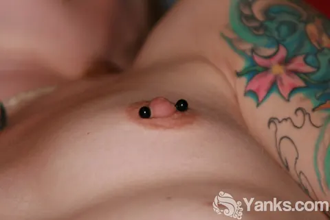 Tattooed Woman with Pierced Nipples Pulls Panties Aside to Finger Her Pussy – photo 10 of 15