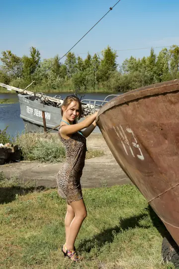 Woman Undresses Out of Her Skirt and Heels on a Rusty Boat