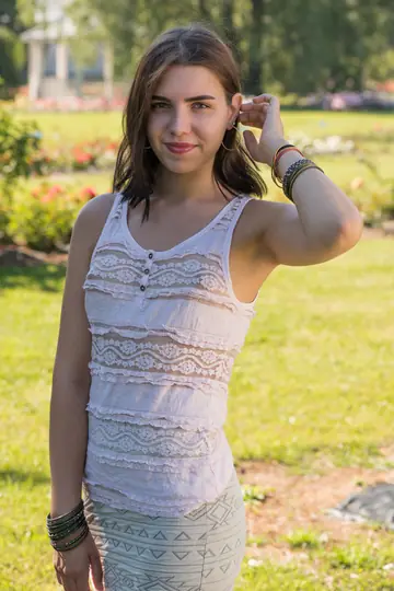 European Brunette Strips Out of Her Skirt and Shows Her Shaved Pussy Outdoors