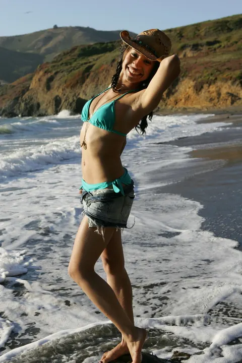 Woman in a Bikini Walks on a Sandy Beach – photo 19 of 21