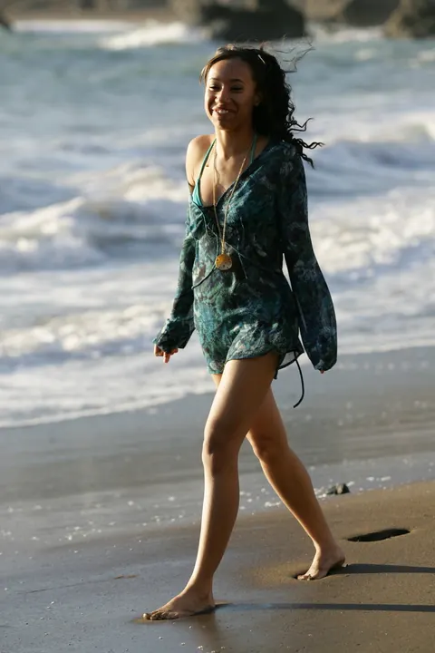 Woman in a Bikini Walks on a Sandy Beach – photo 15 of 21