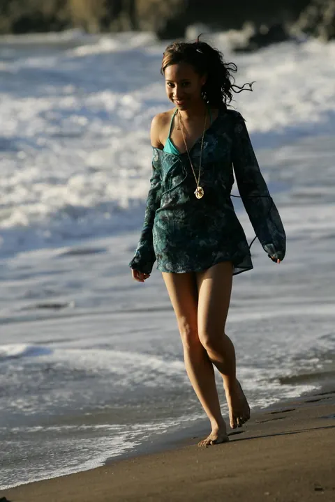 Woman in a Bikini Walks on a Sandy Beach – photo 16 of 21