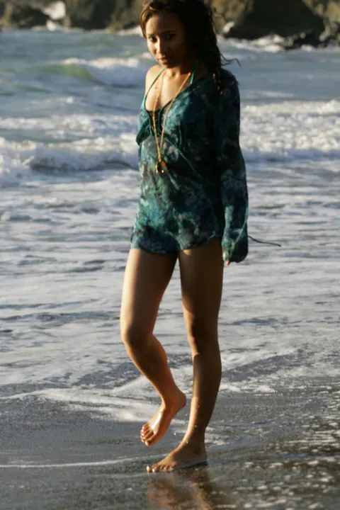 Woman in a Bikini Walks on a Sandy Beach – photo 2 of 21