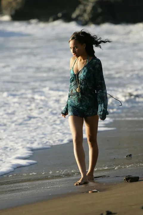 Woman in a Bikini Walks on a Sandy Beach – photo 20 of 21