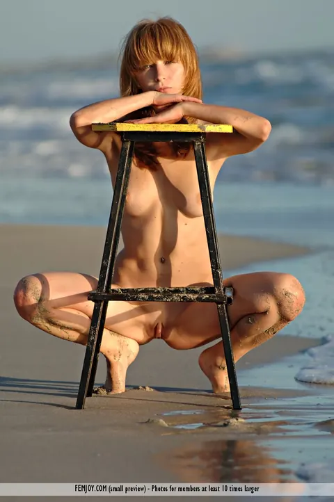 Birgid: Slim European Redhead Poses Nude on a Chair at the Beach – photo 7 of 16