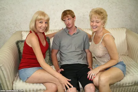Tracy Lick: Two Tall Mature Blondes Share a Cock on the Sofa – photo 1 of 12