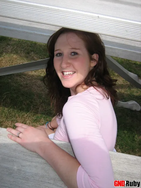 Redhead Flashes Panties in a Skirt and High Heels on Bleachers – photo 12 of 12
