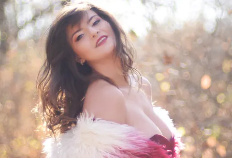 Carolina Rayne: Busty Brunette in a Dress and Heels Poses Among the Trees – photo 15 of 15