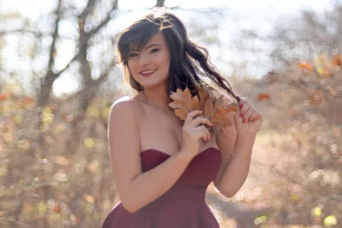 Carolina Rayne: Busty Brunette in a Dress and Heels Poses Among the Trees – photo 4 of 15