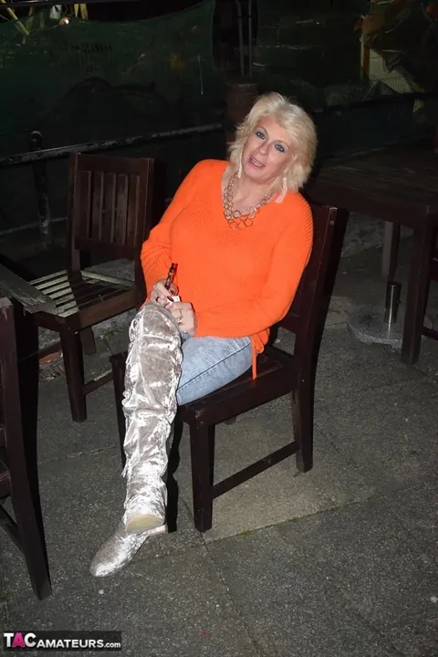 Mature Blonde MILF in Boots Spreads on a Chair Outdoors – photo 3 of 16