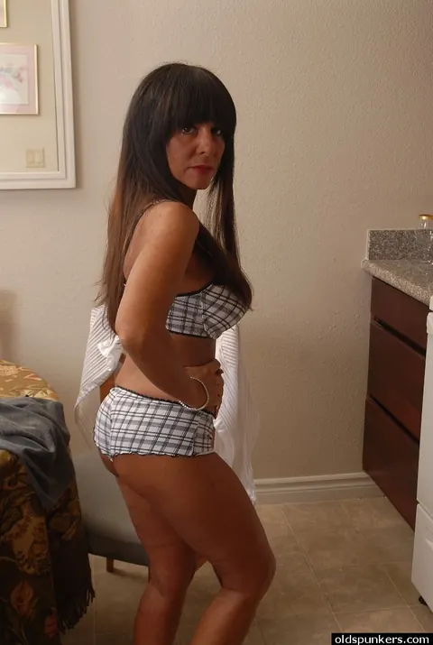 Cassidy Exe: Mature Brunette MILF Reveals Her Shaved Pierced Pussy in the Kitchen – photo 8 of 16