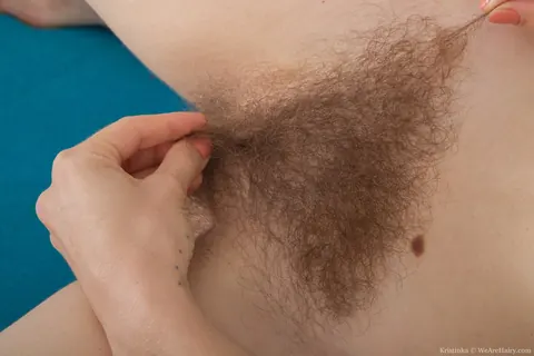 Kristinka: Blonde with Small Natural Tits Bares Her Hairy Pussy on the Sofa – photo 16 of 21