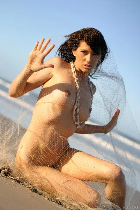Brunette Flaunts Her Big Tits and Ass on the Beach – photo 2 of 21