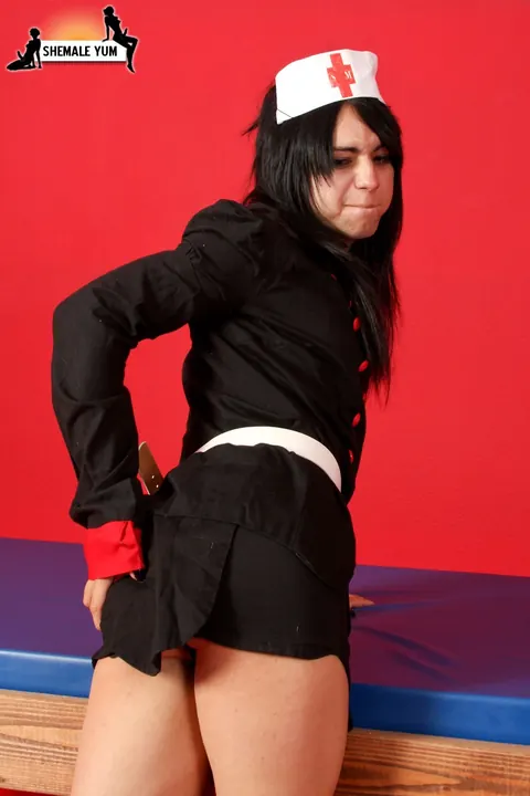 Trans Woman Poses in Costume Uniform Showing Her Body – photo 3 of 16