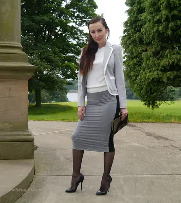 Slim British MILF Shows Off Her Legs on the Park Steps in a Skirt and Heels