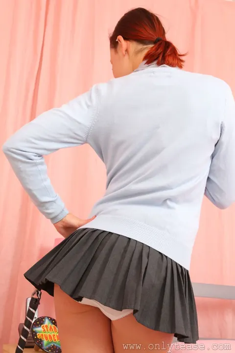 Thick Redhead in Stockings and Skirt Teases on the Bed – photo 2 of 21