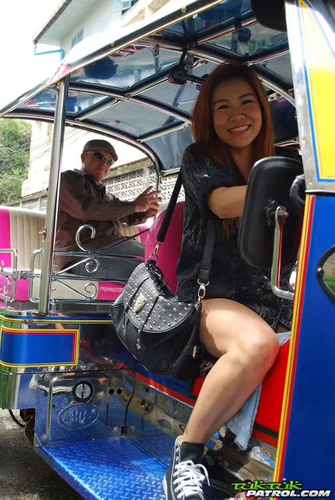 Noy: Thai Brunette Kisses Her Driver in a Mini Taxi Outdoors – photo 10 of 17