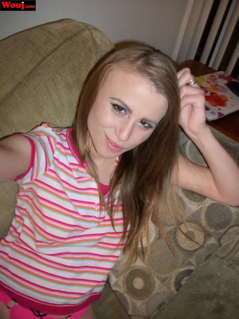 Soleil Saunders: Skinny Amateur Brunette Poses in a Striped Shirt on the Sofa – photo 4 of 15