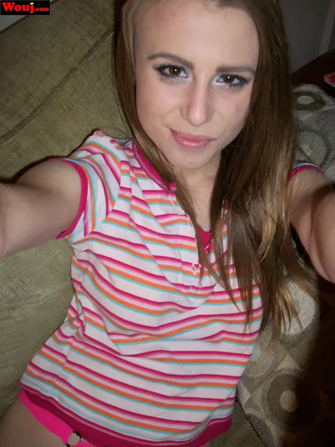 Soleil Saunders: Skinny Amateur Brunette Poses in a Striped Shirt on the Sofa – photo 9 of 15