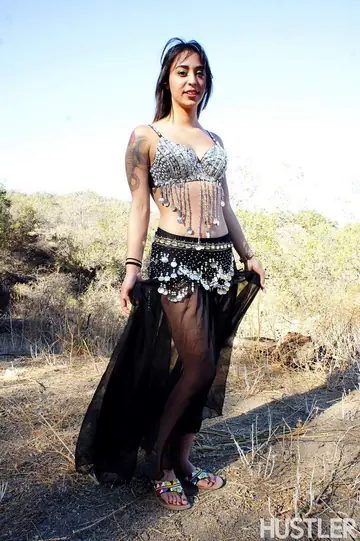 Busty Tattooed Brunette Strips Naked in the Forest