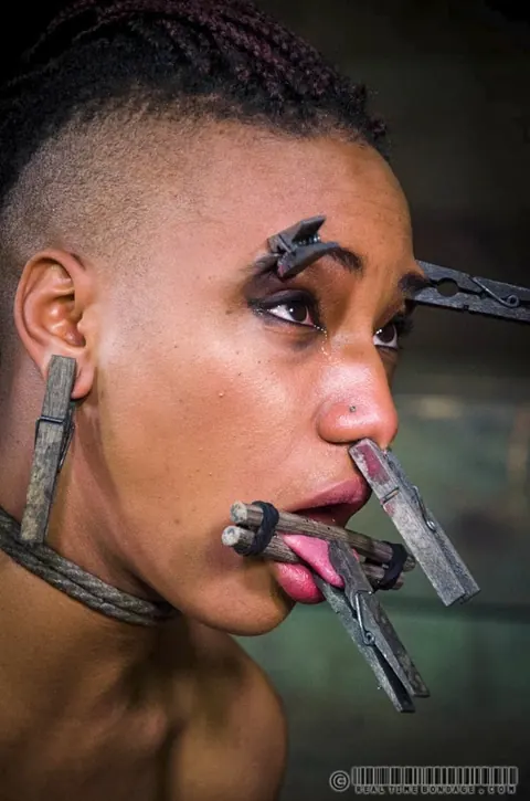 Cadence Cross: Slim Ebony Brunette Gets Restrained and Fucked with a Dildo in a Dungeon – photo 14 of 16