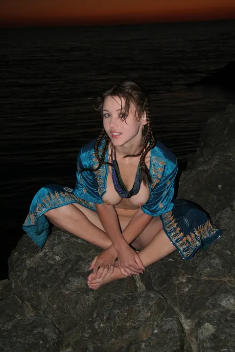 Woman Strips Nude, Kneels, and Arches Back for the Camera – photo 20 of 21