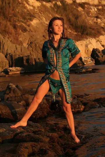 Woman Strips Nude, Kneels, and Arches Back for the Camera