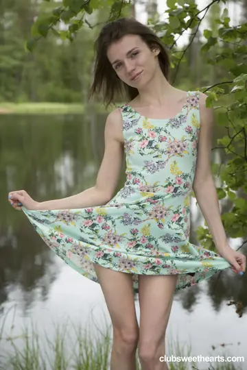 Skinny Woman Undresses by the Lake and Fingers Her Pussy
