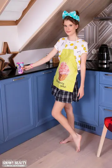 Woman Flashes Panties Under Skirt Then Strips Naked in the Kitchen