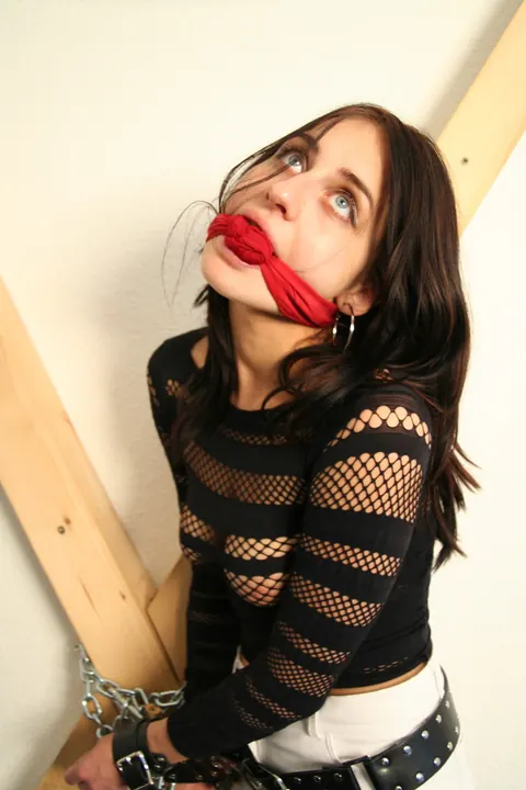Brunette in a Latex Skirt and Boots Restrained with a Cleave Gag – photo 14 of 16