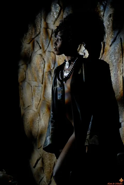 Ebony Woman Poses Against a Stone Wall in the Bathroom – photo 5 of 16