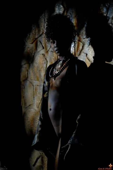 Ebony Woman Poses Against a Stone Wall in the Bathroom – photo 7 of 16